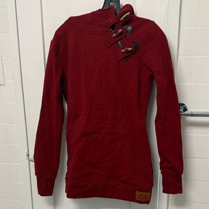 Long tunic style sweater with hood, zipper, and toggle buttons